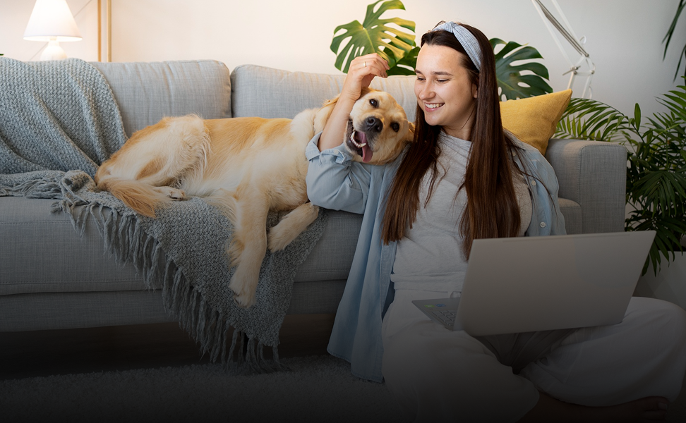 Pet parent relaxing at home with dog on the sofa